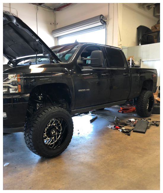 california legal performance upgrades in Chino, CA at Domestic Diesel and Auto Services image of black pickup diesel truck having upgrade services being done to it in the shop