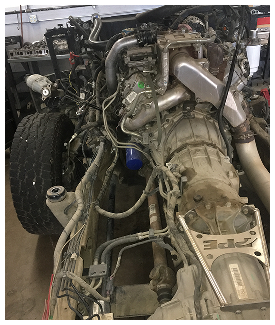 Transmission services in Chino, CA with Domestic Diesel. Image of truck transmission that is being worked on in the shop.
