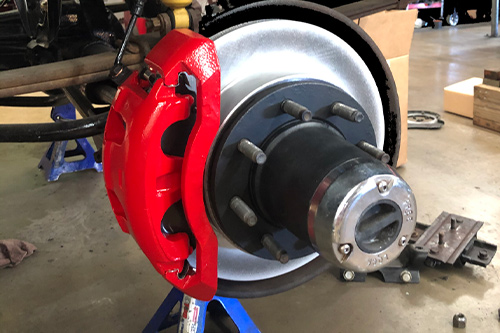 Brake service repair replacement near me in Chino, CA with Domestic Diesel and Automotive Services. Closeup image of new brakes and rotors on a truck that came into the shop for brake repairs.