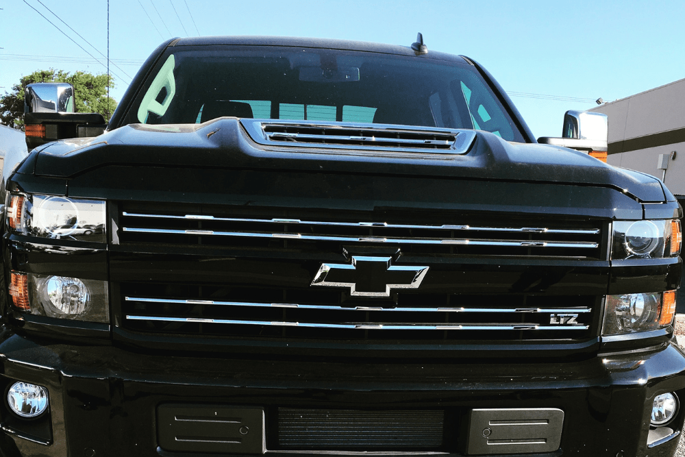 duramax engine, diesel truck repair in Chino, CA at Domestic Diesel & Auto Service. Image of a black Chevy Silverado diesel truck.